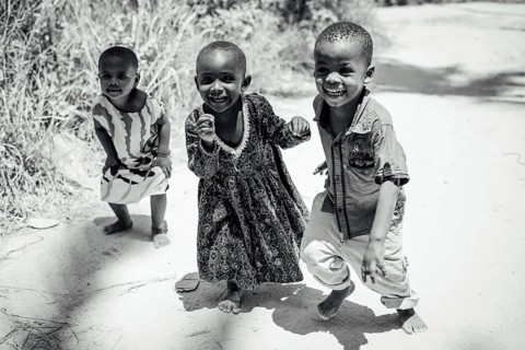 MICHAMVI KAE, ZANZIBAR - OCTOBER 17, 2025: Group of happy and laughing African children playing and