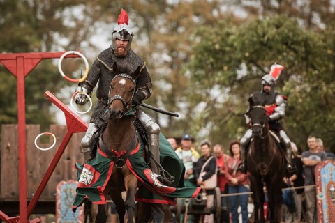 LUBIAZ, POLAND - AUGUST 25, 2018: Monastery Siege - historical staging. Knights horse riding show