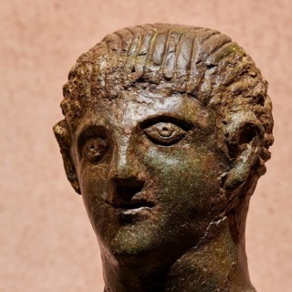 Diocouroi or athlete, ancient bronze sculpture of a male head, distinctive and detailed depiction,