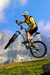 A man on a mountain bike in an alpine landscape