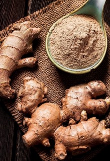 Ground and fresh ginger root, on a wooden table, rustic style, selective focus, no people