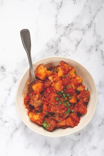 Stew with potatoes and vegetables, in tomato sauce, with spices and herbs, close-up, homemade, no