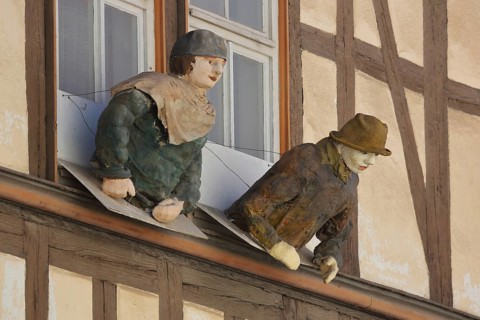 Two life-size sculptures leaning out the window, modern art, crafts, dolls, upper body, funny,