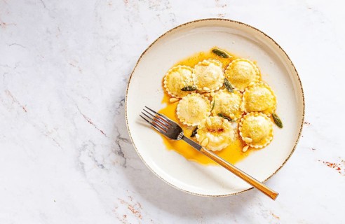 Ravioli with butter and sage, Italian dish, top view, no people
