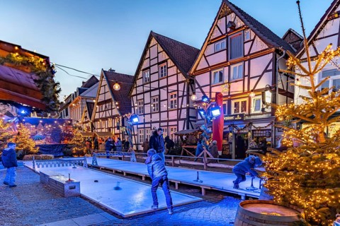 Curling at the Christmas market and timbering in Soest at dusk, North Rhine-Westphalia, Germany