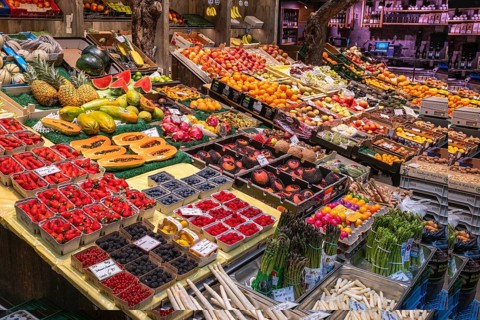 Market stand with local and exotic fruits in the Markthalle Stuttgart, Baden-Württemberg, Germany
