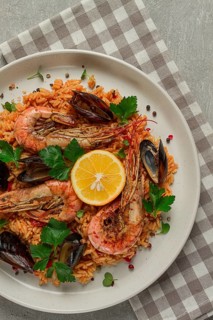 Seafood paella, shrimp and mussels risotto, rice, homemade, top view, no people
