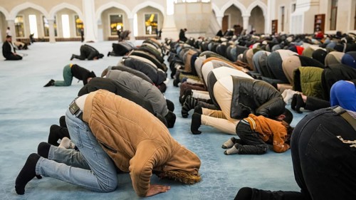 Muslims perform Tarawih prayers at the Millet Mosque, the second largest mosque in Turkey, which is
