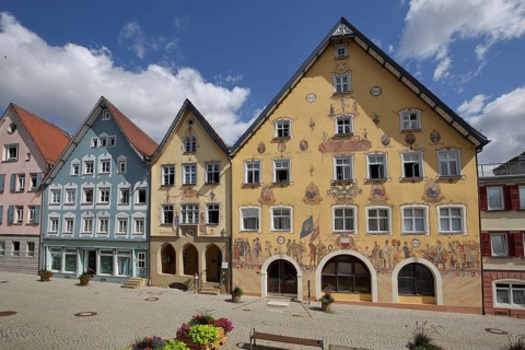 Historic half-timbered houses with town hall built in 1765 with wall painting and yellow guard
