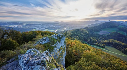 View from the Gisliflue of an autumnal forest with the Jura foothills behind, Talheim, Canton,
