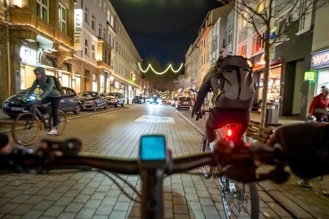 Cycling in the city, in the dark, in the evening, inner-city road, bicycle road, two-wheeler