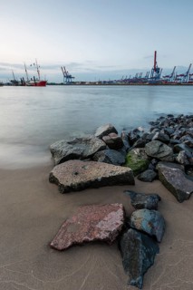 Elbe beach with container terminal and ships in the background in Hamburg