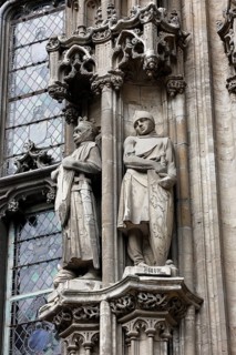 Historic town hall Stadhuis, partial view of the façade in Flamboyant Gothic style with sculptures,