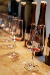 Wine glasses and wine bottles, stylishly arranged on a wooden table, wine tasting, Palatinate,
