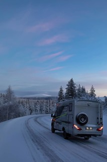 Motorhome in front of the Pallastunturi National Pack in winter, Lapland, Finland