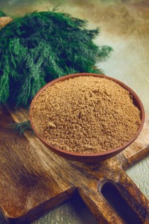 Dried dill, in a ceramic bowl, a bunch of fresh dill, seasoning, top view, no people