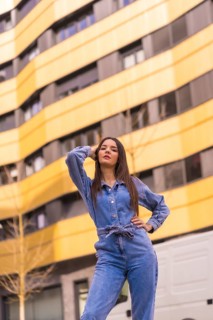 Young caucasian girl with a monkey cowboy in a yellow and black house. Enjoying the city on