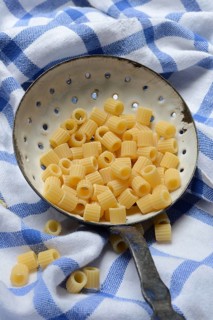 Tubetti rigati, Italian pasta variety, pasta in a ladle, Italy