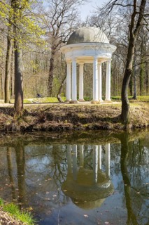 Diana Temple in Lützschena Castle Park with reflection in the water, Leipzig, Saxony, Germany