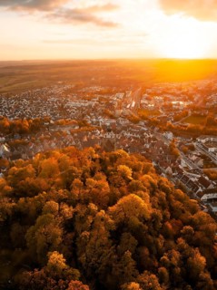 Aerial view of an autumnal cityscape in the evening light, Herrenberg, Germany