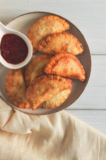 Fried chebureks, close-up, on a light background, no people
