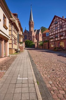 Untere Walldürner Straße with St John's Church and half-timbered house in Miltenberg, Lower