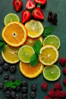 Mix of fruits and berries, set, assortment, sliced citrus fruits, raspberries, blueberries, mint