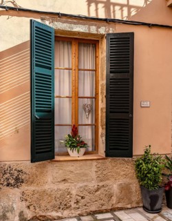 Detail photo, house facades of the historic houses in the old town of Alcudia, Majorca, Spain