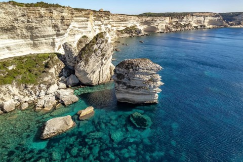 The white chalk cliffs of the cliffs near Bonifacio seen from the air, Corsica, France