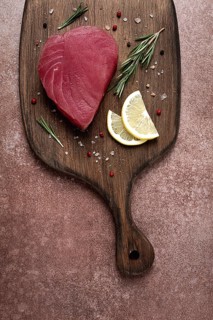Fresh red tuna fillet, for steak, raw, top view, on a cutting board, no people