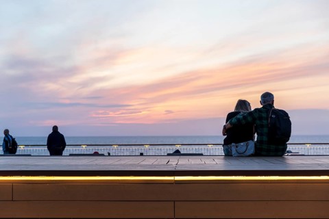 Couple watching sunset on ferry crossing from Rostock in Germany to Trelleborg in Sweden