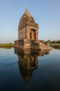 Baneswar temple (Small Hindu temple dedicated to Shiva) in the middle of the holy Narmada River,