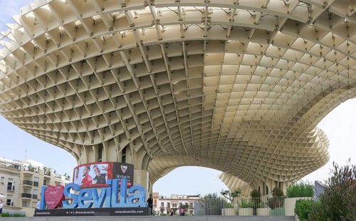 Metropol Parasol, futuristic wooden structure with large, eye-catching Seville lettering in the