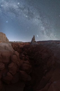 Spectacular view of the Milky Way galaxy over the eerie rock formations of Goblin Valley State Park