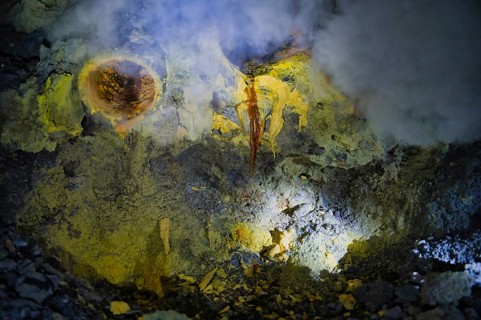 Sulfur deposits at Ijen Volcano, Indonesia, showcase vibrant hues from volcanic activity. This