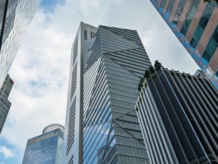 From below a captivating view of modern skyscrapers in Singapore, showcasing reflective glass