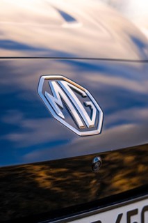 Close-up of a car emblem on the back of a black car, e-car sharing, Deer Mobility, MG4, Calw,