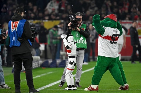 During the DFL and VfB Stuttgart Innovation Matchday, an AI-supported robot hands over the Adidas