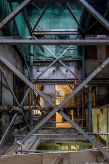 A detailed view of a construction site interior, showcasing a complex arrangement of steel beams,