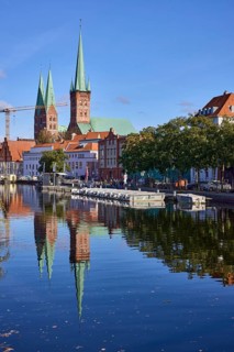 Church towers of St. Marien and St. Petri, reflections on the water surface, Hanseatic city of