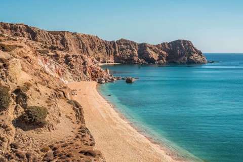 Discover Paleochori Beach on Milos Island, Greece, with its golden sands and crystal-clear