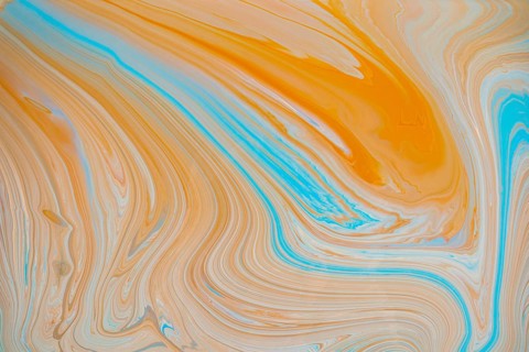 A vibrant abstract image showcasing flowing swirls of orange and teal acrylic paint hues. The fluid