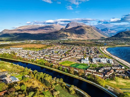 View of Caledonian Canal, Caol Beach and Nevis Range Mountains from a drone, Corpach, Fort William,