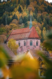 Historic Hirsau Monastery in autumn forest, Calw, Black Forest, Germany