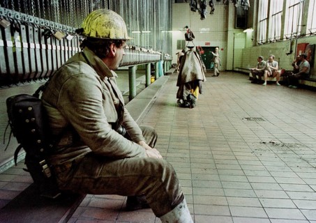 A miner from Ewald Colliery sits on a bench in the laundry room. The mine was discontinued in 2000,