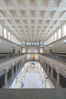 Light-flooded, symmetrical building interior with corridors and columns, Zurich, Switzerland