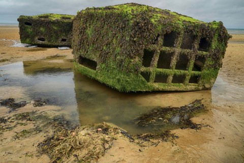France, Normandy, Arromanches-les-Bains, Mulberry Harbour, rusting remains from D-Day of the Allies