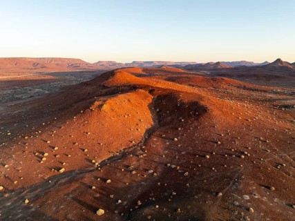 Aerial view, evening mood, hills and dry landscape near Palmwag, Kunene region, Namibia