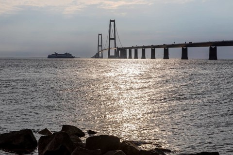 Large Color Line ferry crossing the Storebelt Bridge seen from Halsskov Odde viewpoint, East