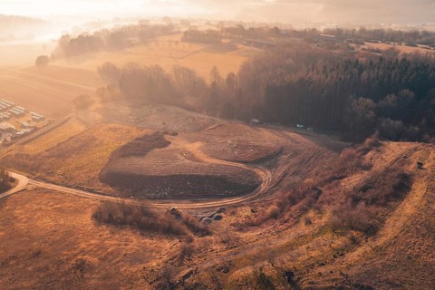 Dawn over a hilly landscape with trees and fields in soft autumn colors, landfill, Gechingen, Calw